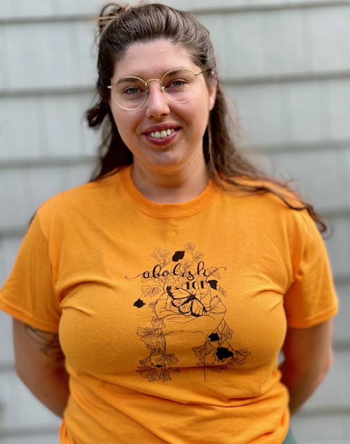 Woman wearing Abolish ICE t-shirt
